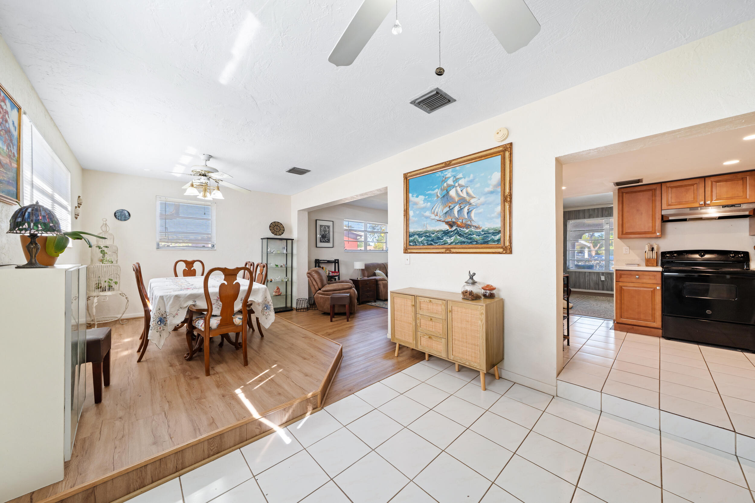 10730 Southwest 151st Street Miami, FL 33176 - Photo 11 of 26 a living room with furniture and a flat screen tv