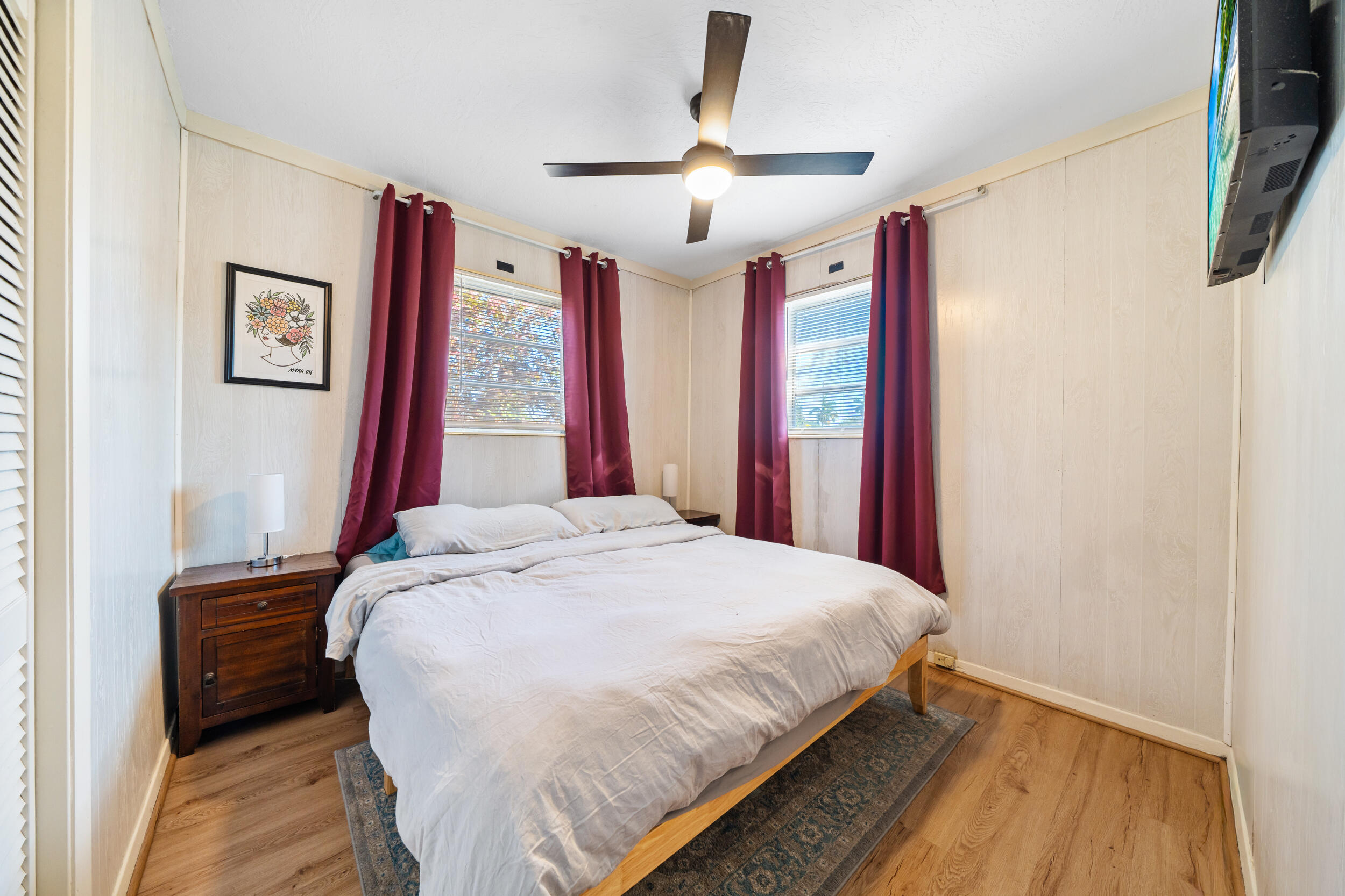 10730 Southwest 151st Street Miami, FL 33176 - Photo 17 of 26 a bedroom with a bed and a chandelier