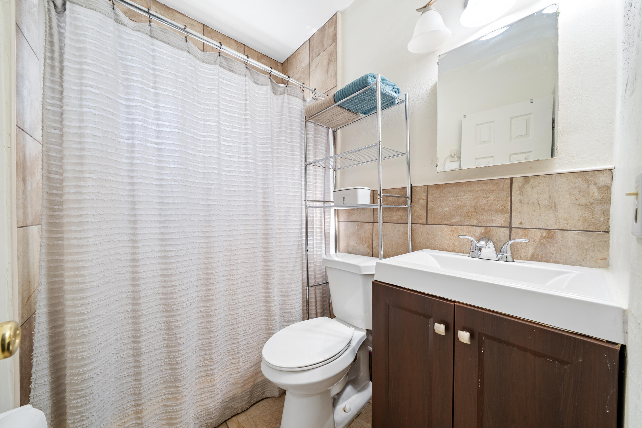 10730 Southwest 151st Street Miami, FL 33176 - Photo 20 of 26 a bathroom with a sink toilet and shower