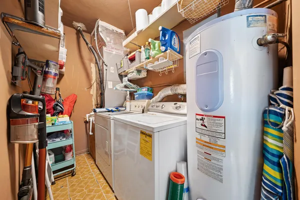 a yellow house with trees in front of it