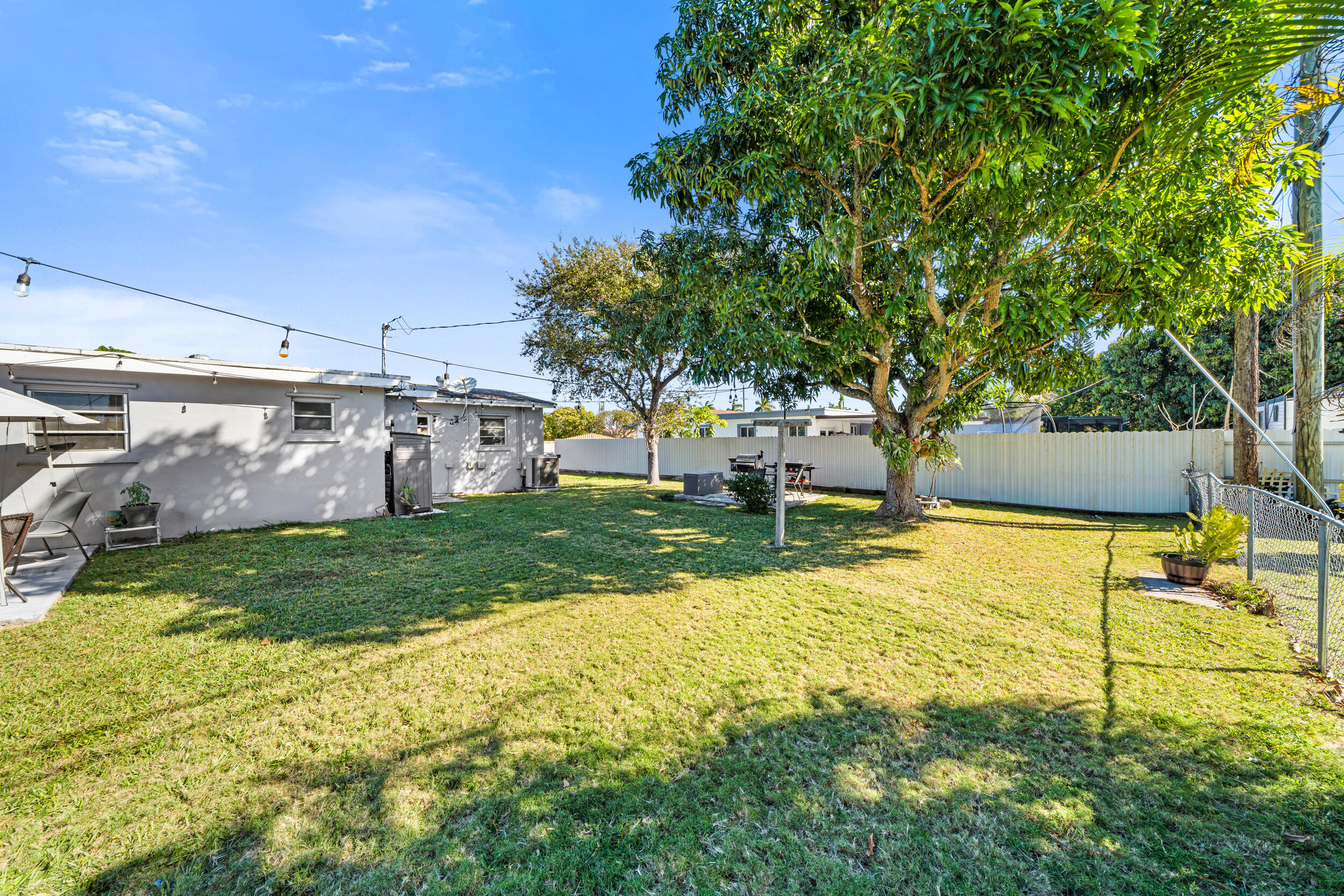 10730 Southwest 151st Street Miami, FL 33176 - Photo 25 of 26 a view of a yard with basketball court
