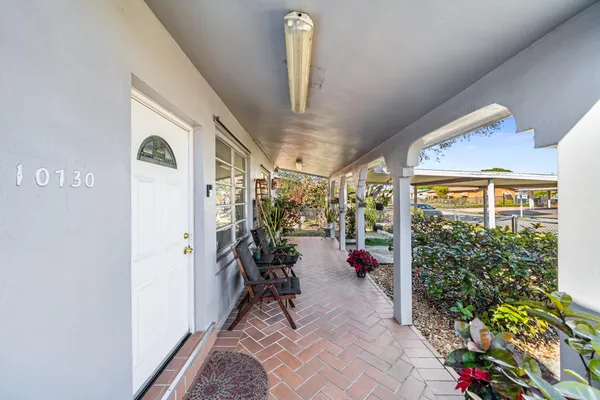 a view of house with a garden