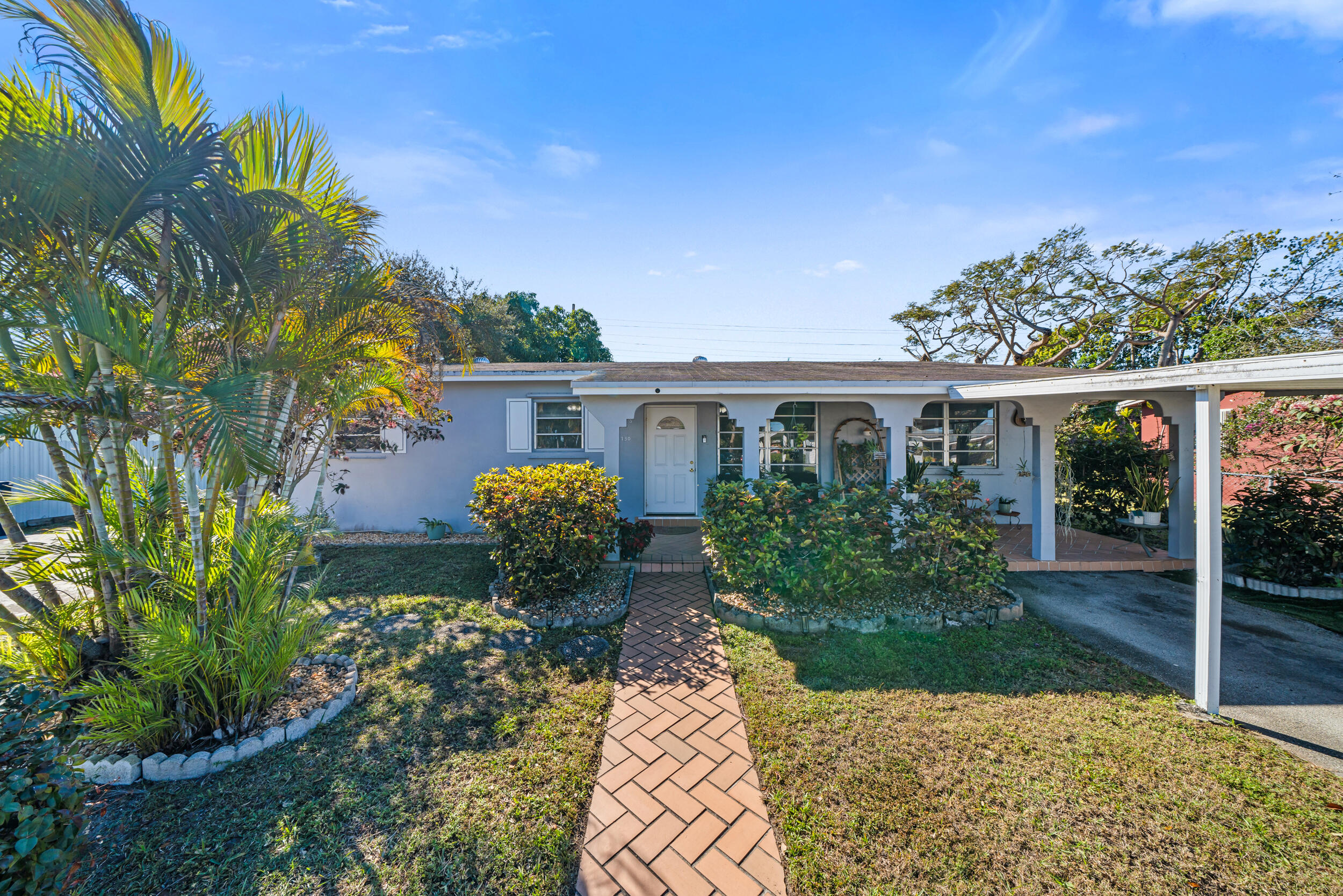 10730 Southwest 151st Street Miami, FL 33176 - Photo 5 of 26 a view of house with a garden