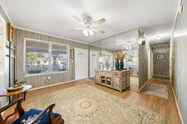 a bedroom with furniture and a window