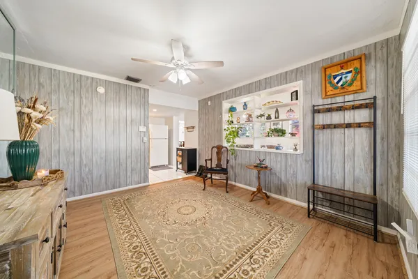 a view of a dining room with furniture and wooden floor
