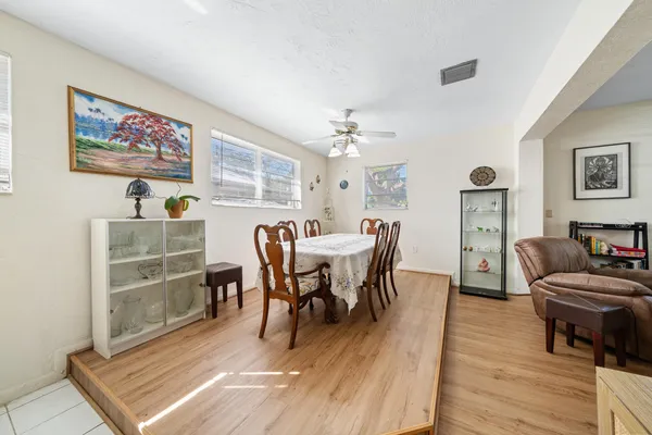a kitchen with stainless steel appliances granite countertop a sink refrigerator and cabinets