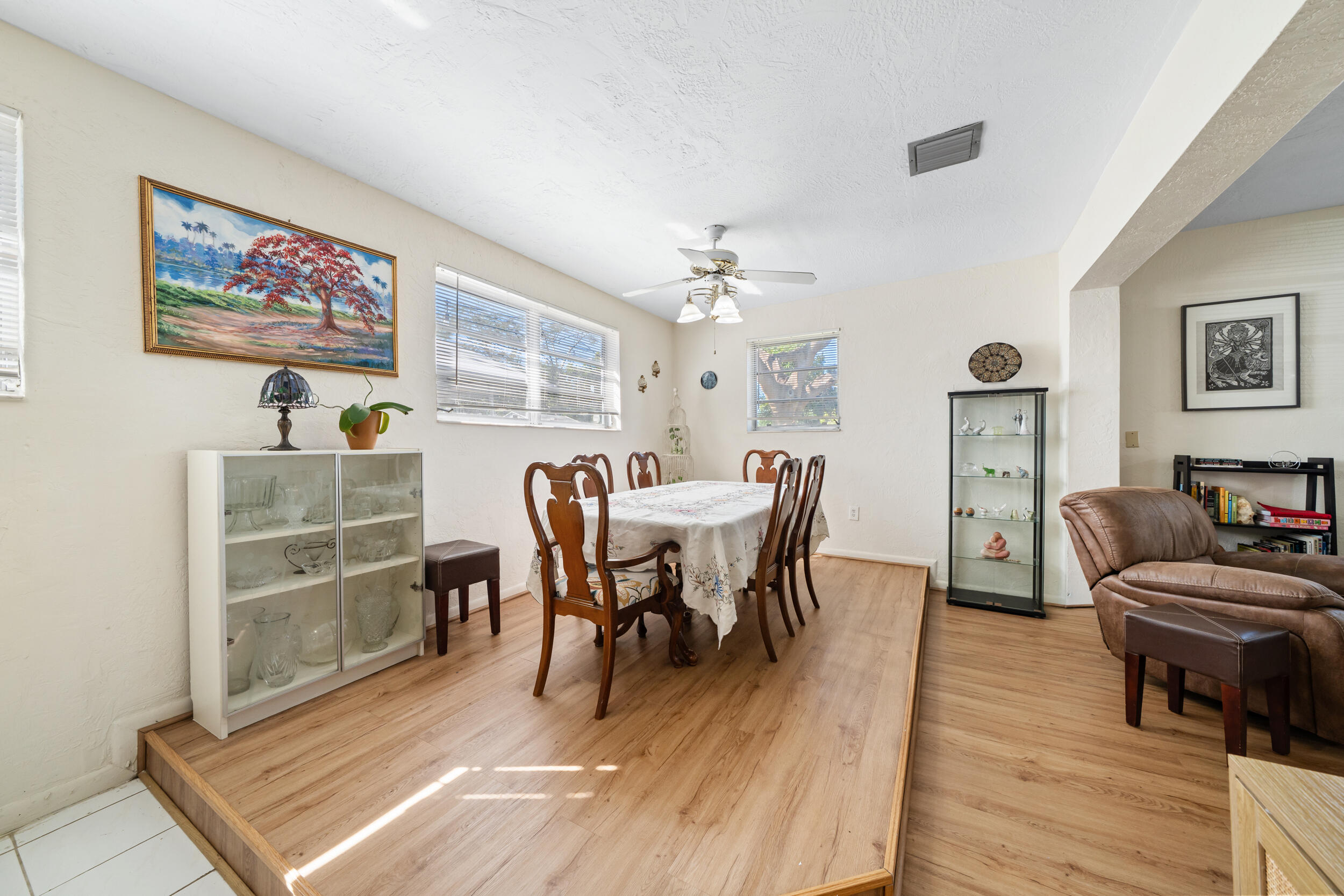 10730 Southwest 151st Street Miami, FL 33176 - Photo 8 of 26 a view of a dining room with furniture and wooden floor