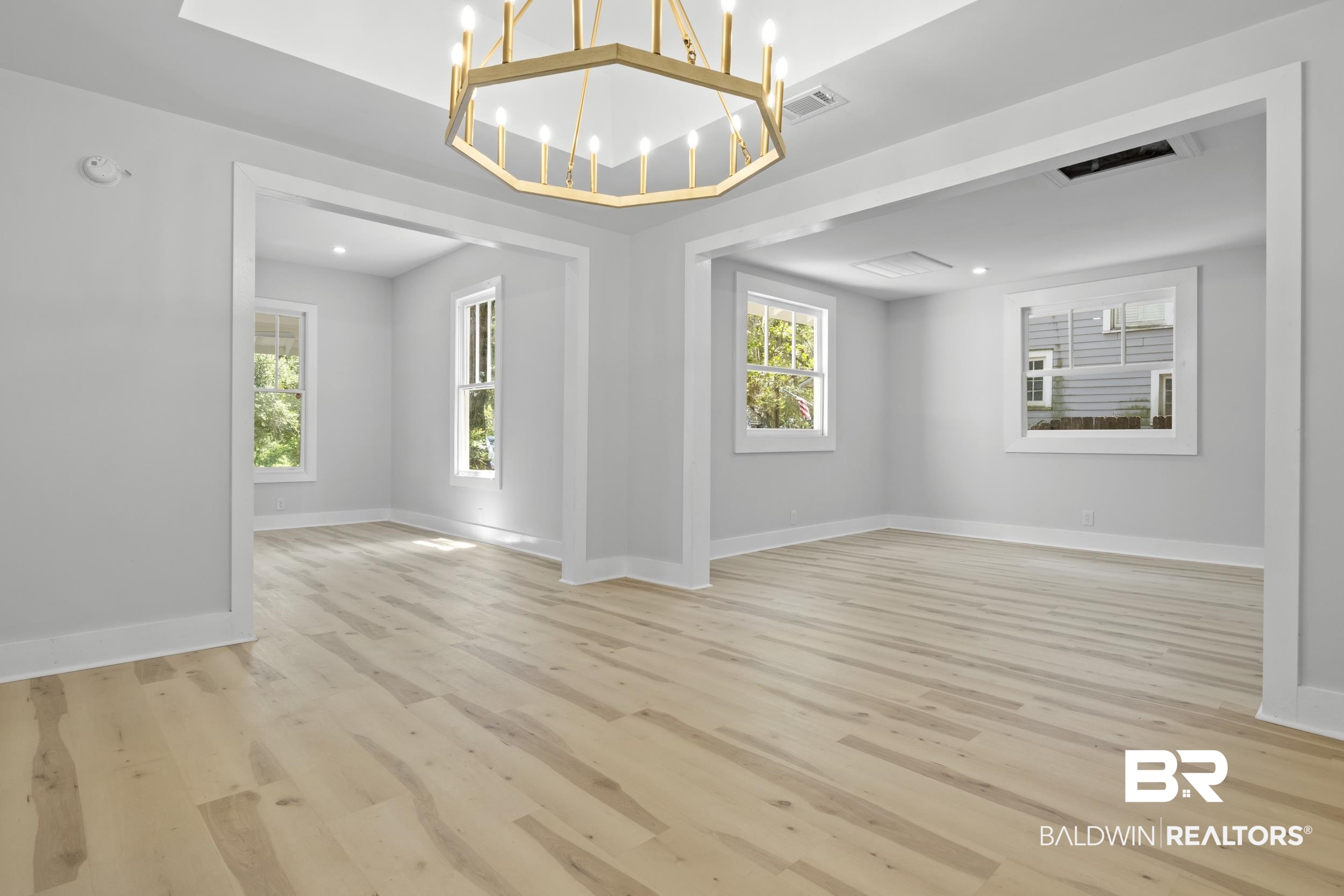 315 Park Avenue Mobile, AL 36607 - Photo 11 of 27 Unfurnished dining area featuring light hardwood / wood-style flooring and a chandelier