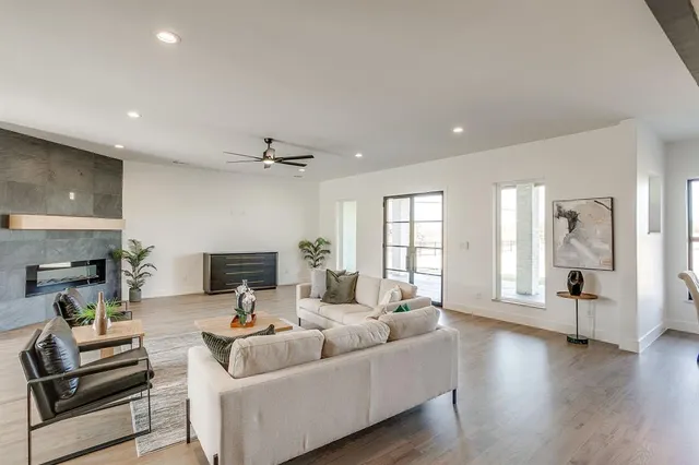 a living room with furniture and a fireplace