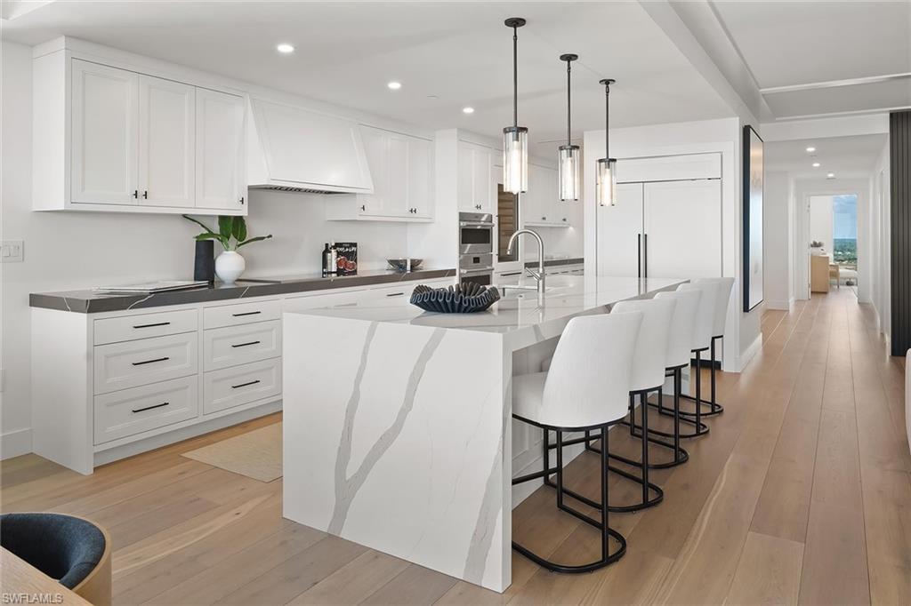 13935 Old Coast Road, Unit 2206 Naples, FL 34110 - Photo 14 of 50 Chefs’ kitchen complemented by a well-appointed butler’s pantry adding storage and prep space