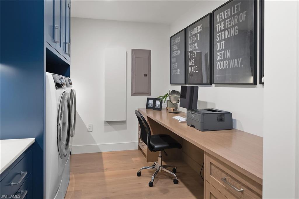 13935 Old Coast Road, Unit 2206 Naples, FL 34110 - Photo 21 of 50 Spacious laundry room with a custom built-in desk, perfectly doubling as a home office