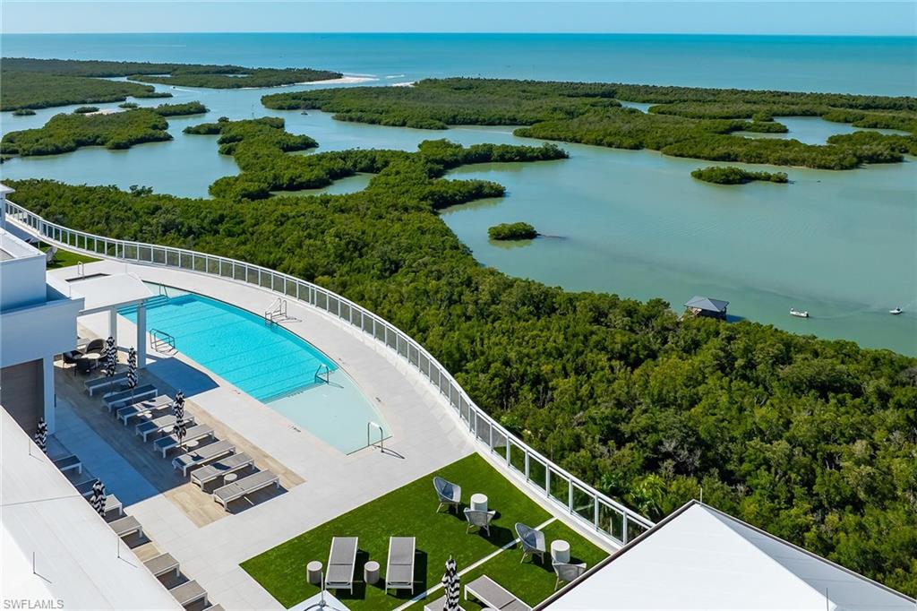 13935 Old Coast Road, Unit 2206 Naples, FL 34110 - Photo 28 of 50 Resort-style Tower 300 rooftop pool, sundeck, barbecue areas, social spaces, restrooms, open air fitness and showers