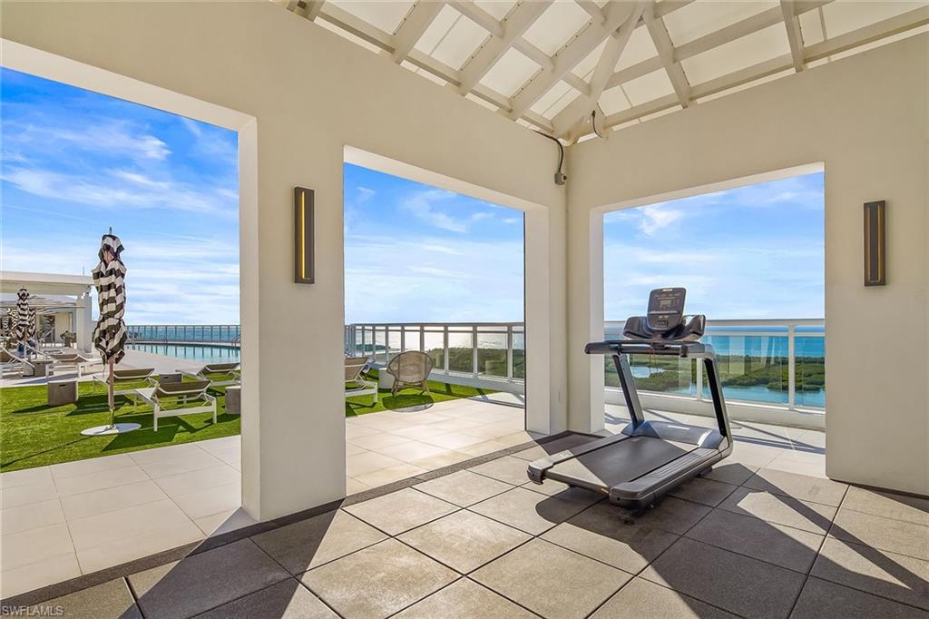 13935 Old Coast Road, Unit 2206 Naples, FL 34110 - Photo 29 of 50 Stay energized in the open-air rooftop fitness space, framed by inspiring coastal views