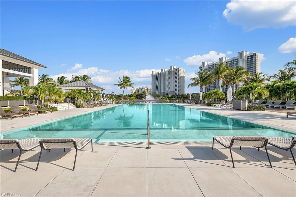 13935 Old Coast Road, Unit 2206 Naples, FL 34110 - Photo 34 of 50 Lakefront lap pool designed for fitness and relaxation amid serene water views