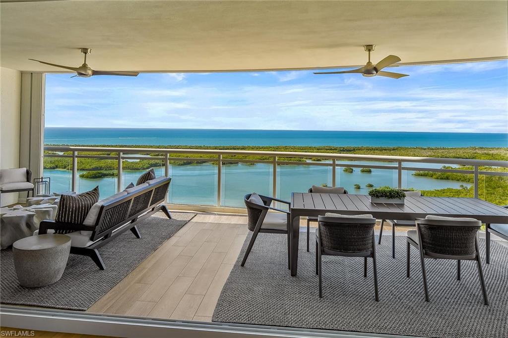 13935 Old Coast Road, Unit 2206 Naples, FL 34110 - Photo 5 of 50 Sweeping views of the Intracoastal and the Gulf of Mexico from the spacious 32-foot terrace, where boats glide by and dolphins often play