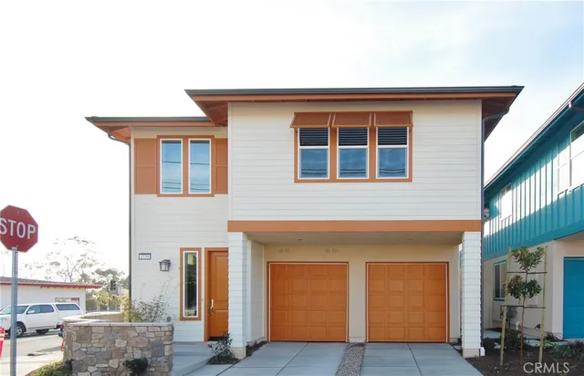a front view of a house with yard