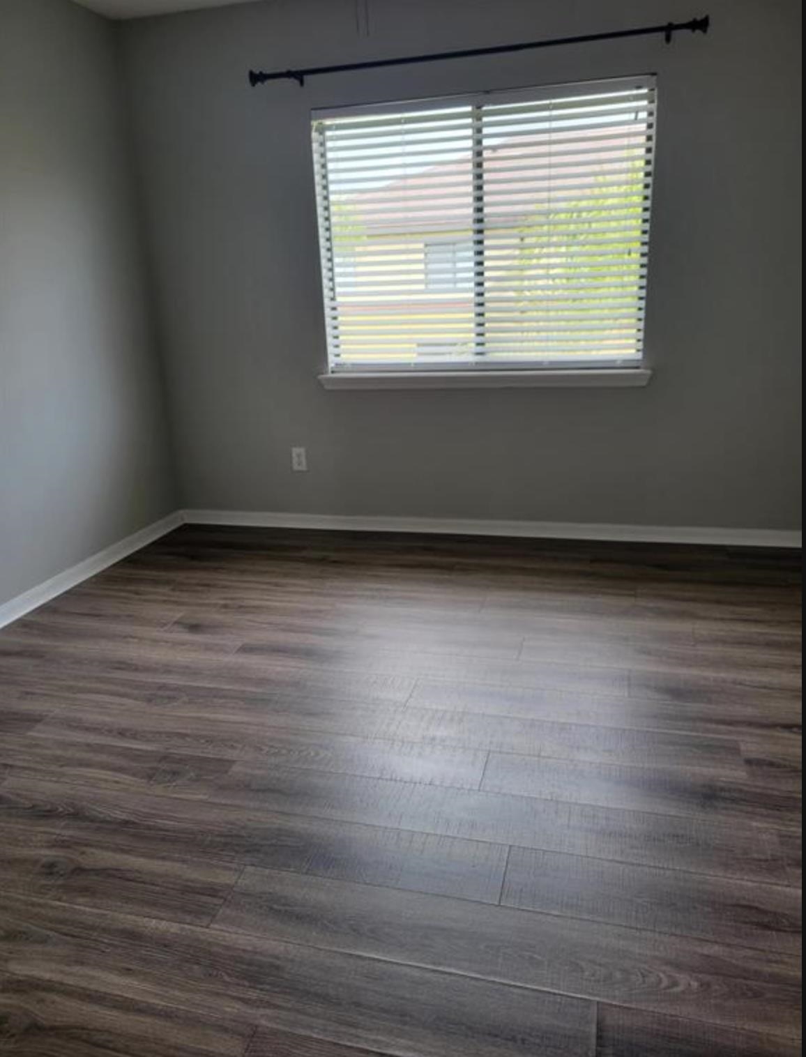 5 Rachel Court St. Augustine, FL 32080 - Photo 14 of 15 a view of an empty room with wooden floor and a window