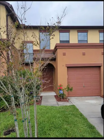 a view of a building with a yard