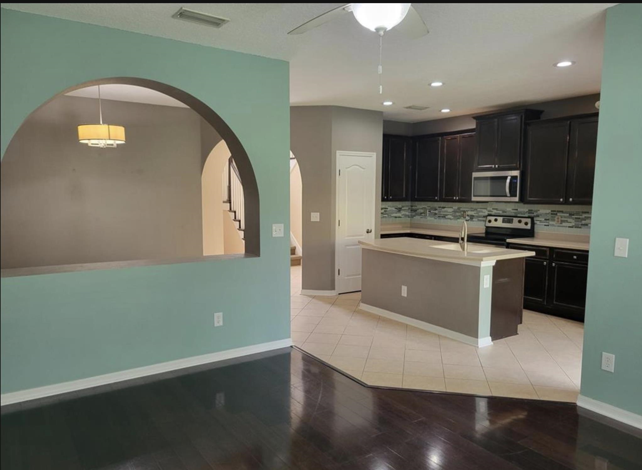 5 Rachel Court St. Augustine, FL 32080 - Photo 6 of 15 a kitchen with stainless steel appliances granite countertop a stove a sink and a microwave
