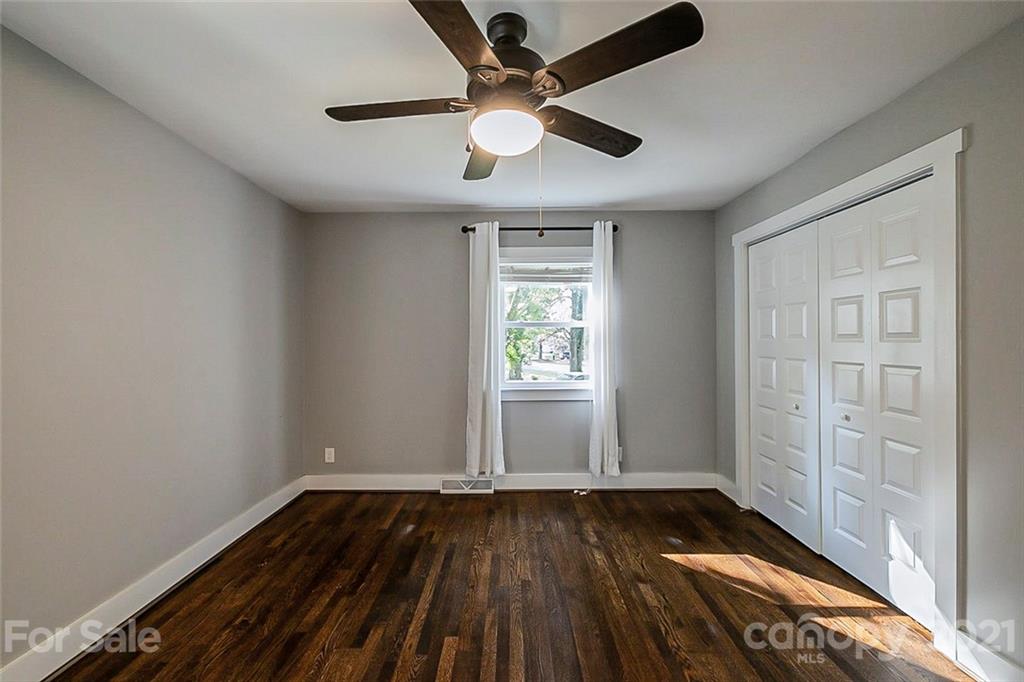 4001 Brookview Drive Charlotte, NC 28205 - Photo 11 of 16 wooden floor in an empty room with a window