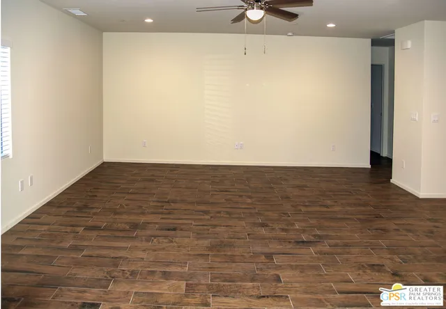 a view of room with window and wooden floor