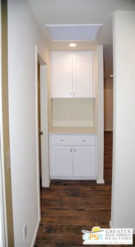 a view of a kitchen with wooden floor