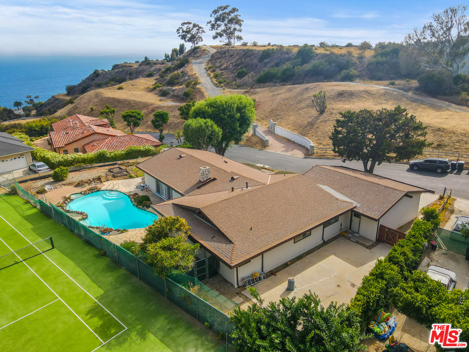20734 Las Flores Mesa Drive Malibu, CA 90265 - Photo 1 of 23 an aerial view of a house with a garden