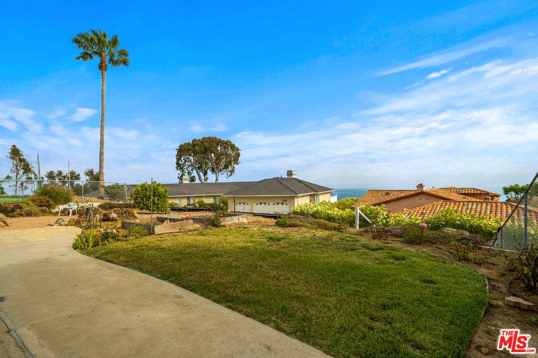 20734 Las Flores Mesa Drive Malibu, CA 90265 - Photo 18 of 23 a swimming pool with lawn chairs