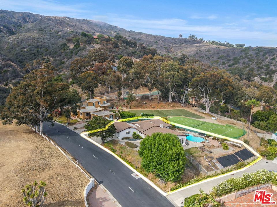 20734 Las Flores Mesa Drive Malibu, CA 90265 - Photo 21 of 23 a view of a swimming pool with a mountain view