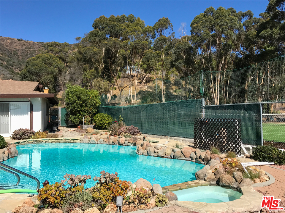 20734 Las Flores Mesa Drive Malibu, CA 90265 - Photo 4 of 23 a view of a lake with a mountain view