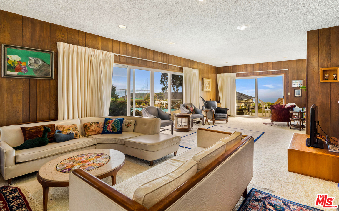 20734 Las Flores Mesa Drive Malibu, CA 90265 - Photo 6 of 23 a living room with furniture and a large window