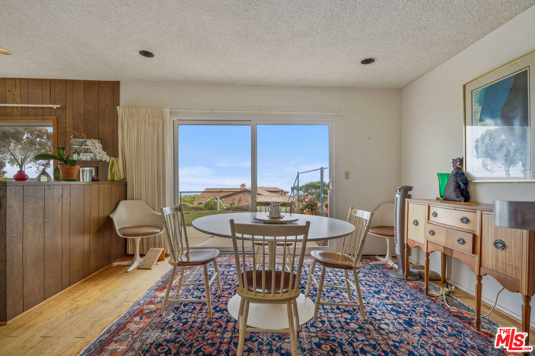 20734 Las Flores Mesa Drive Malibu, CA 90265 - Photo 7 of 23 a view of a dining room with furniture window and outside view