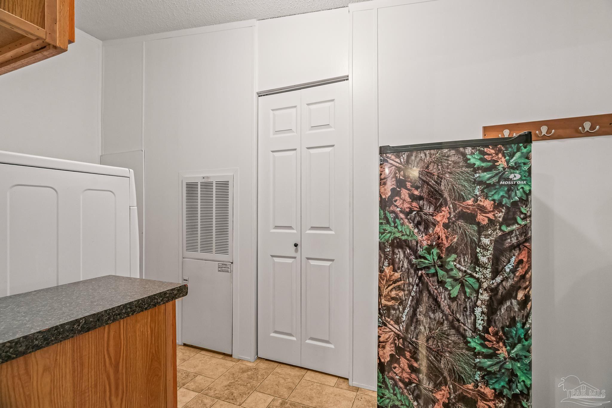 5105 April Lane Pace, FL 32571 - Photo 47 of 57 a view of a storage and utility room with closet