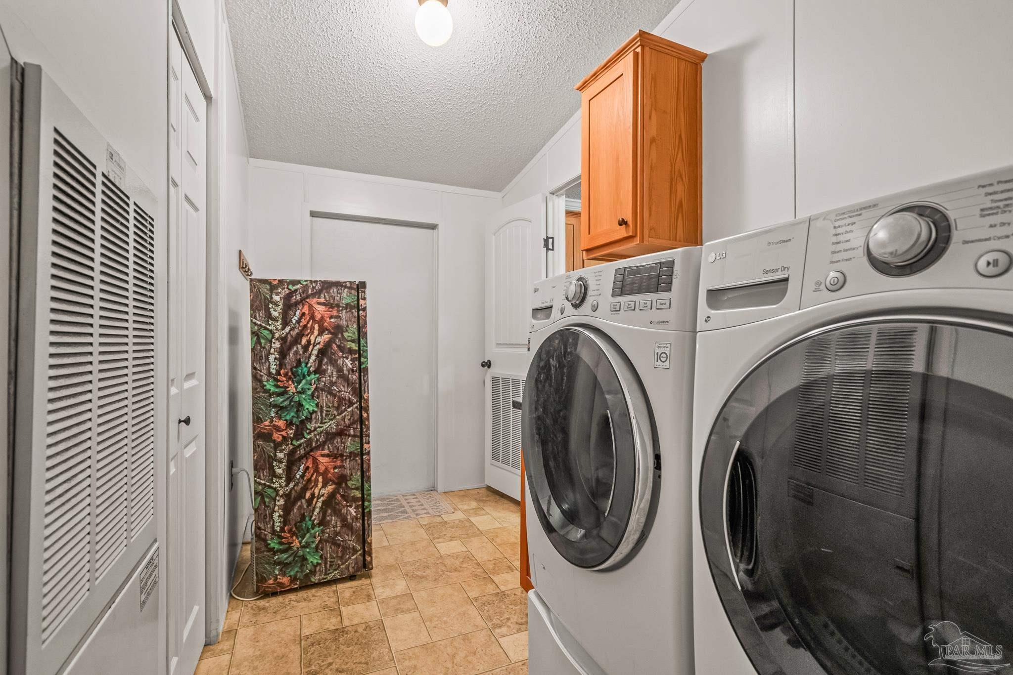 5105 April Lane Pace, FL 32571 - Photo 49 of 57 a utility room with dryer and washer