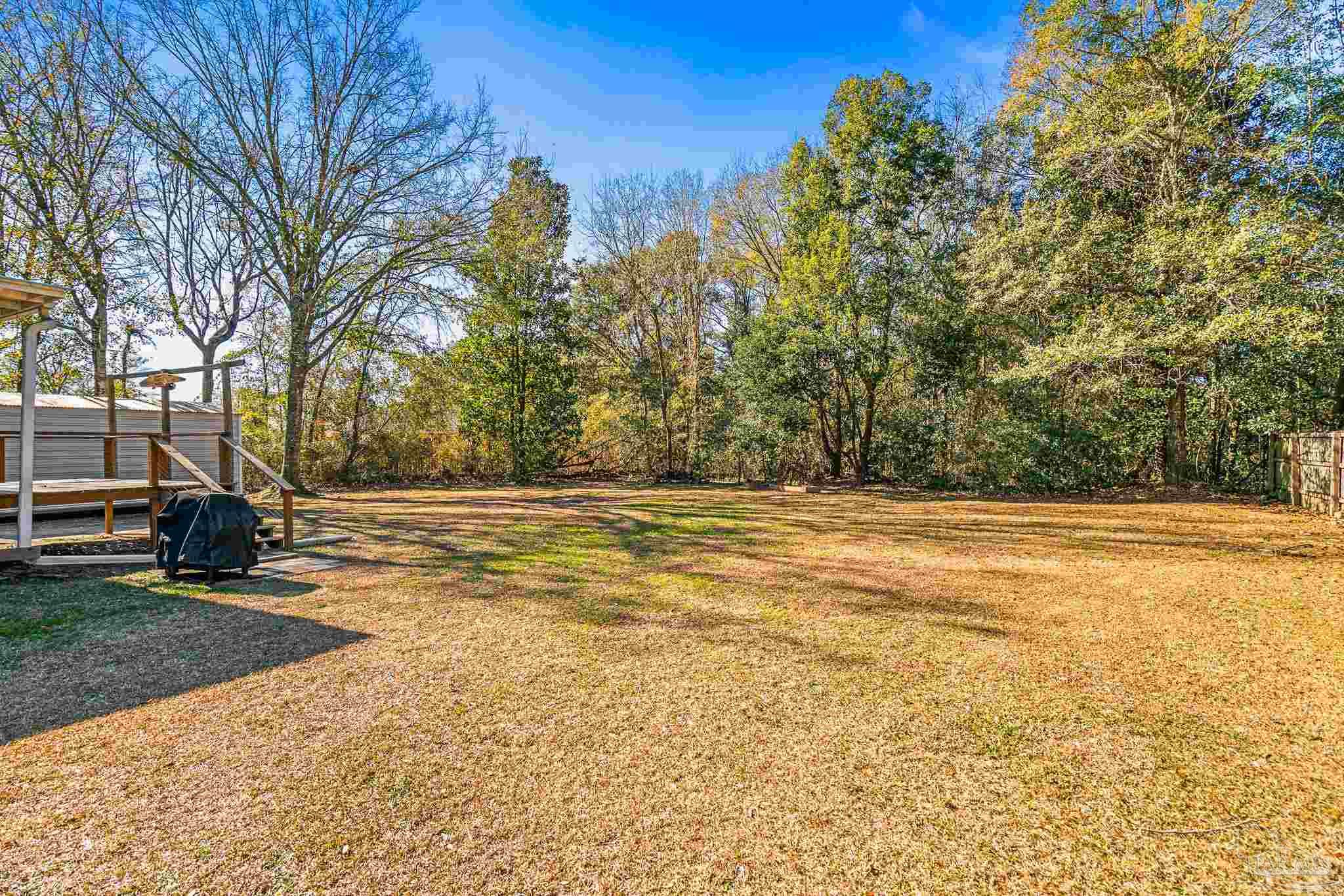 5105 April Lane Pace, FL 32571 - Photo 54 of 57 a view of outdoor space yard and basketball court