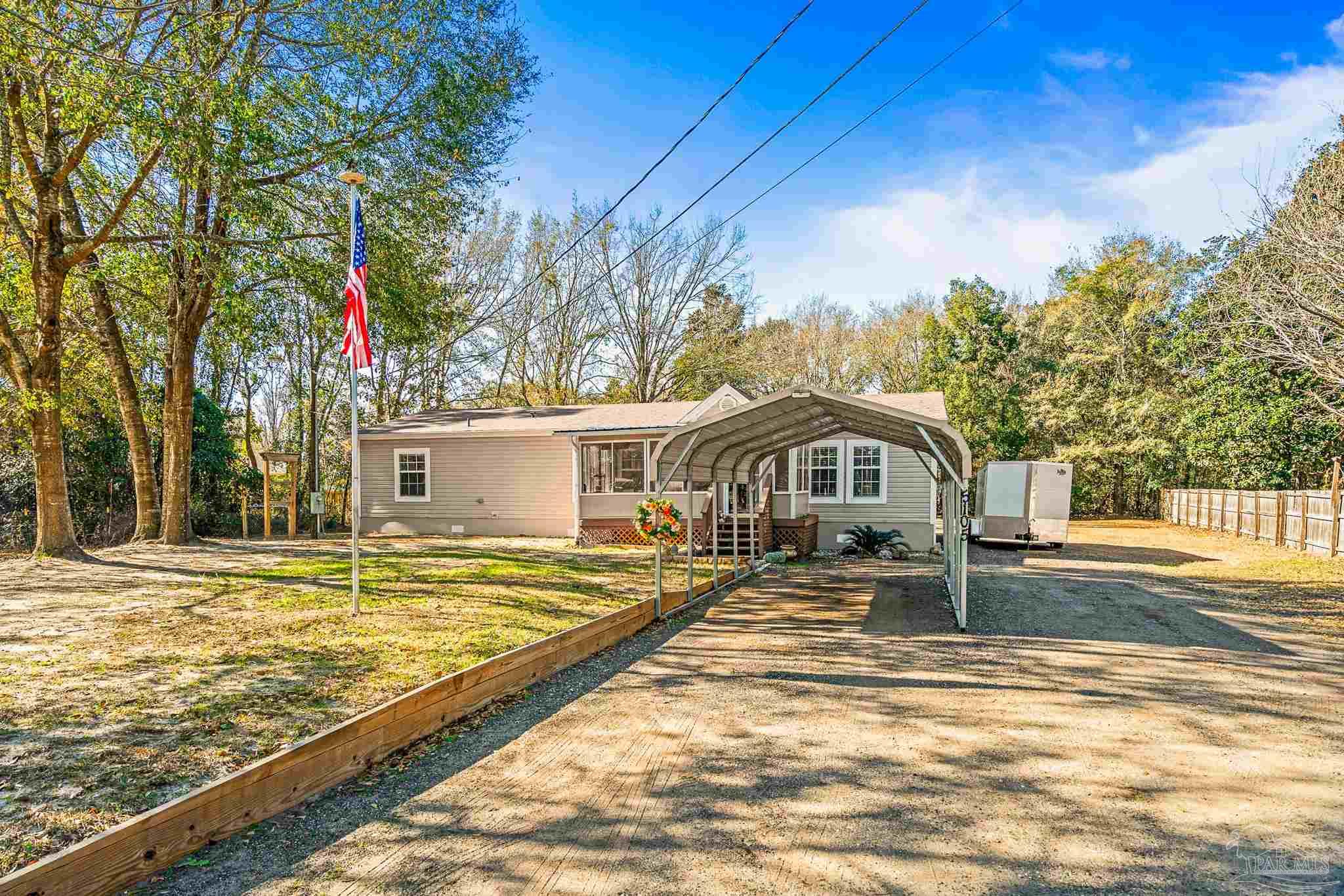 5105 April Lane Pace, FL 32571 - Photo 57 of 57 a front view of a house with a yard