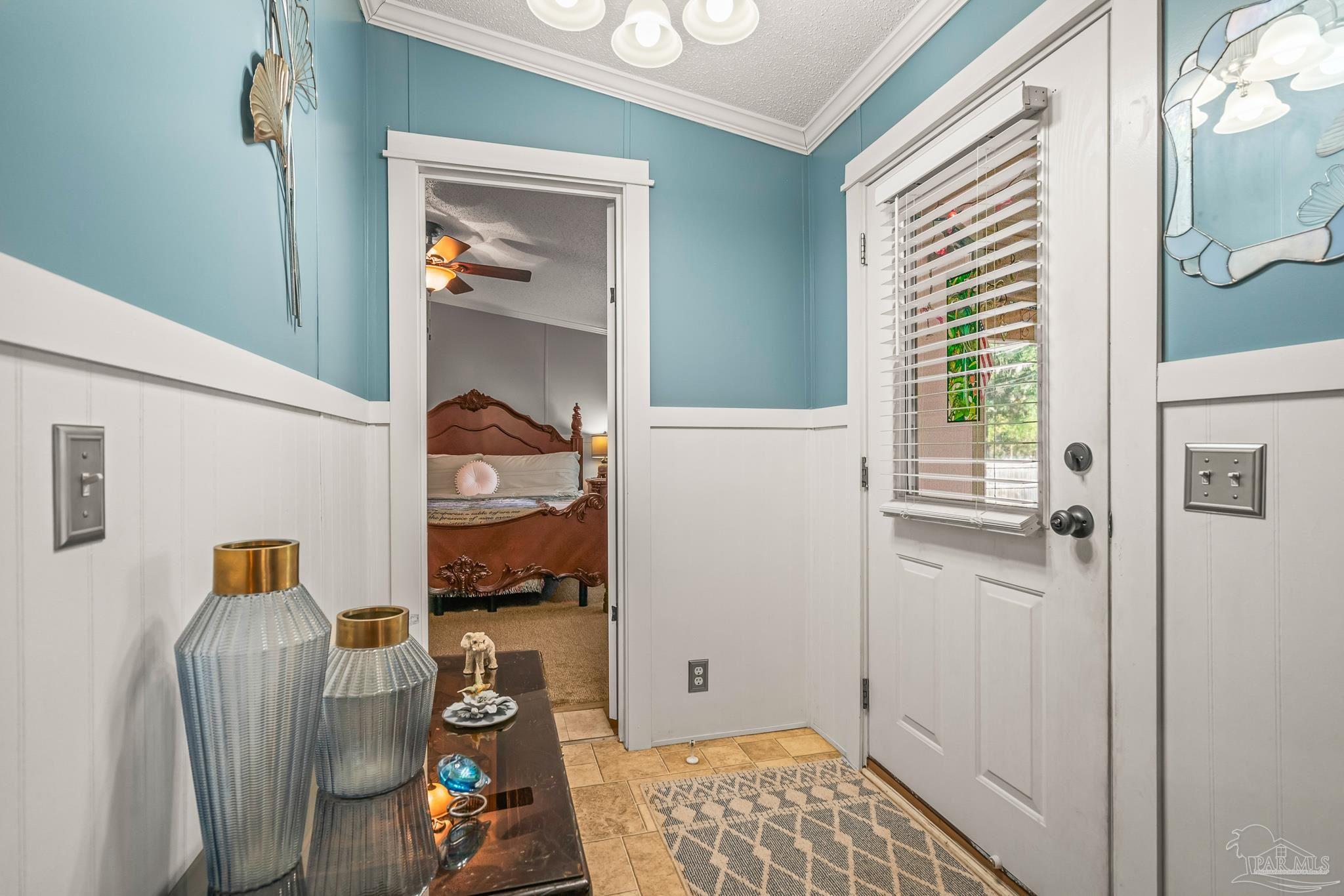 5105 April Lane Pace, FL 32571 - Photo 10 of 57 a bedroom with a bed and a window