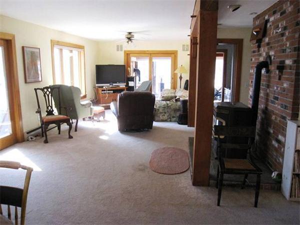 280 Mountain Road Gill, MA 01354 - Photo 9 of 26 a living room with furniture a flat screen tv and a window