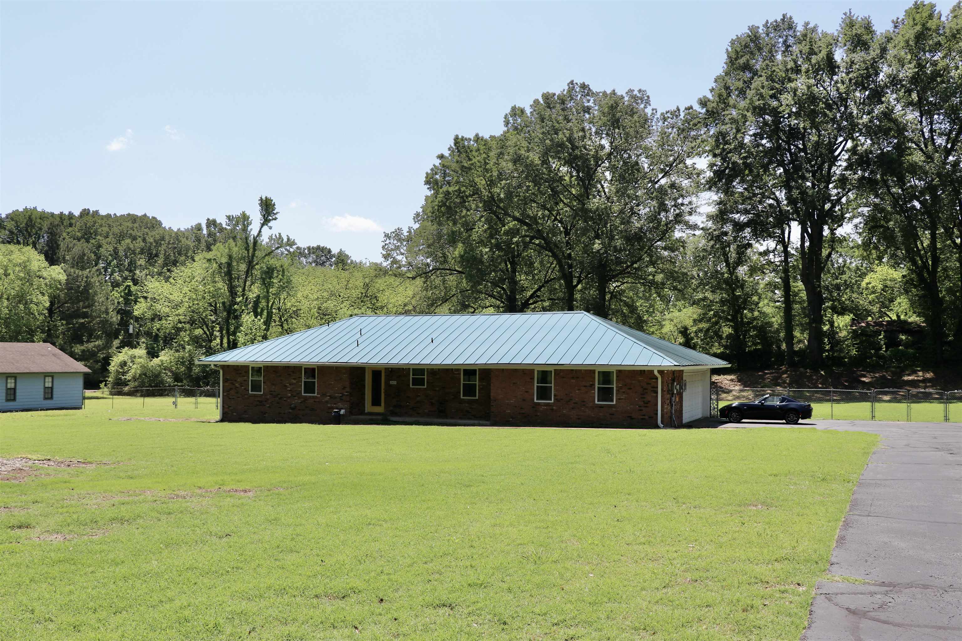2415 Fite Road Memphis, TN 38127 - Photo 9 of 10 a front view of house with yard and trees