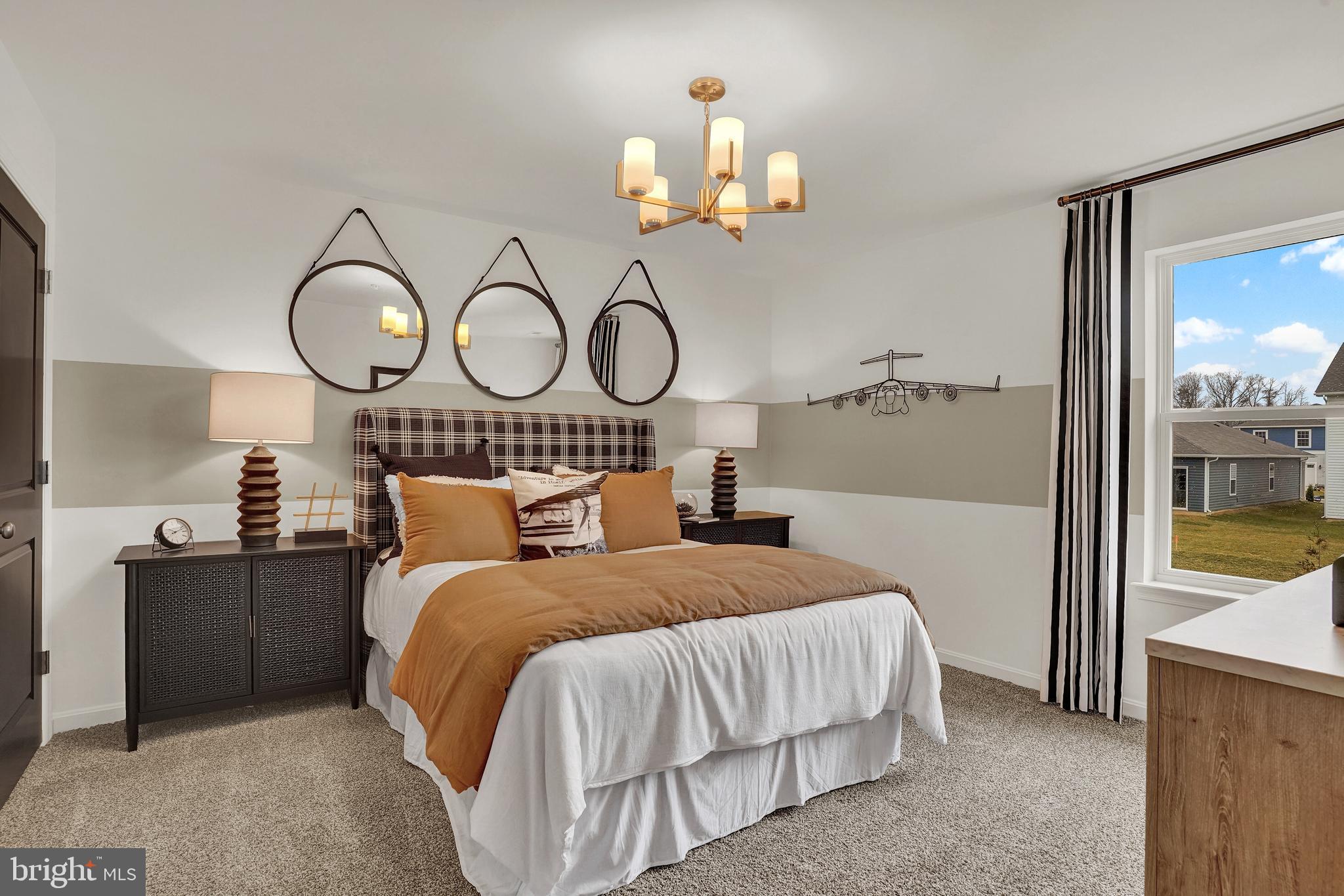 301 Eclipse Street Ranson, WV 25438 - Photo 13 of 26 a bedroom with a bed mirror and a window