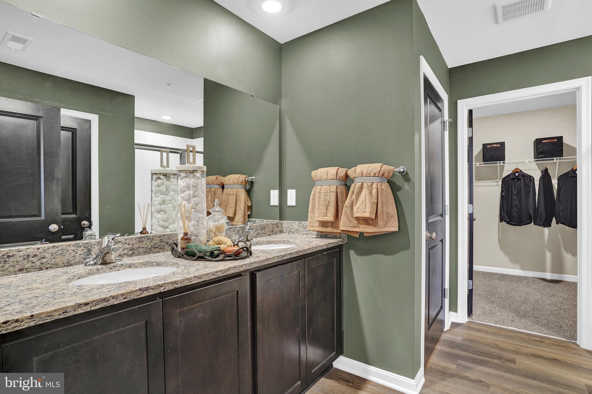 301 Eclipse Street Ranson, WV 25438 - Photo 19 of 26 a bathroom with a granite countertop sink and a mirror