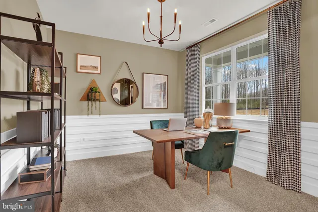 a room that has a table and a chair in it