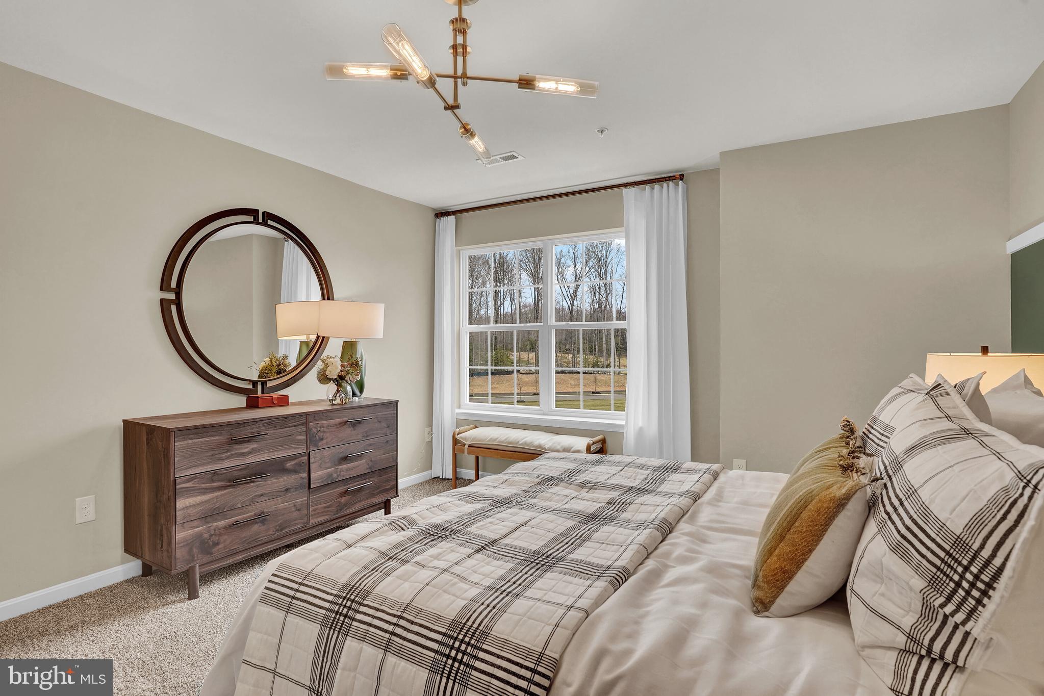 301 Eclipse Street Ranson, WV 25438 - Photo 23 of 26 a bedroom with a bed and a dresser