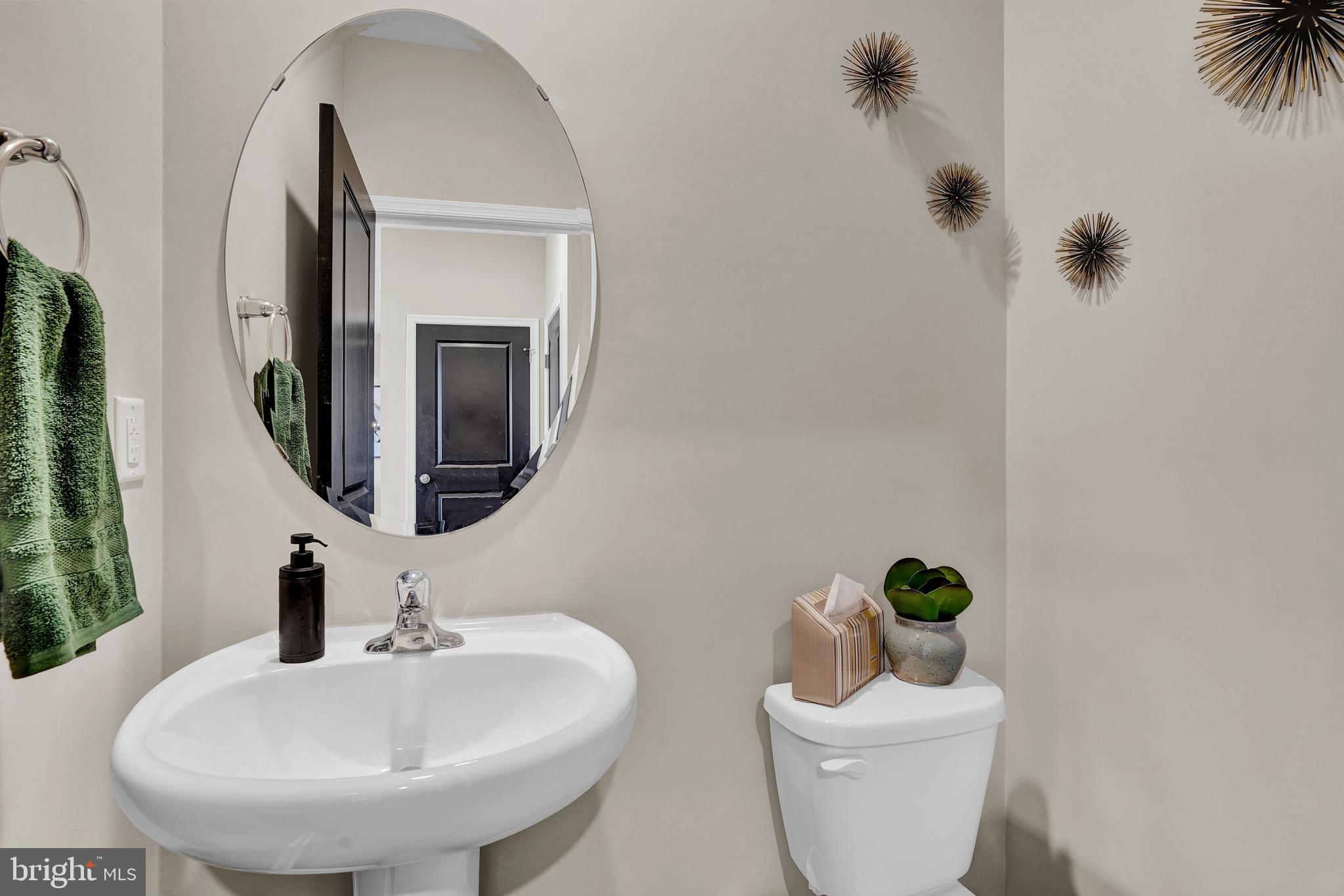 301 Eclipse Street Ranson, WV 25438 - Photo 4 of 26 a bathroom with a toilet sink and mirror