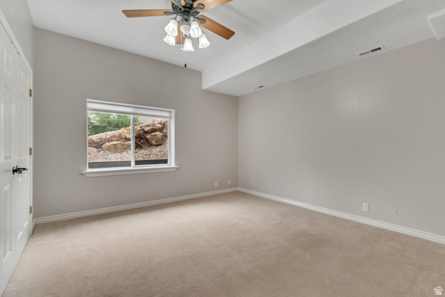 2154 Wasatch Boulevard Sandy, UT 84092 - Photo 40 of 55 Spare room featuring light carpet and ceiling fan