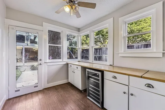 a view of center island with wooden floor and a window