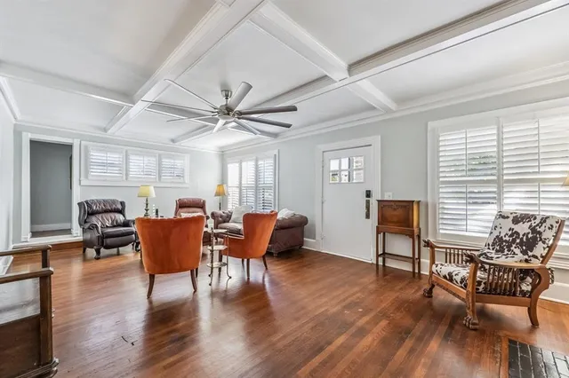 a view of a livingroom with furniture window and wooden floor