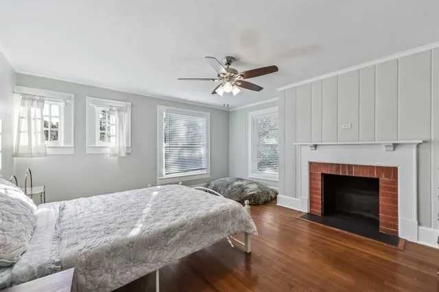 a bedroom with a bed and a fireplace