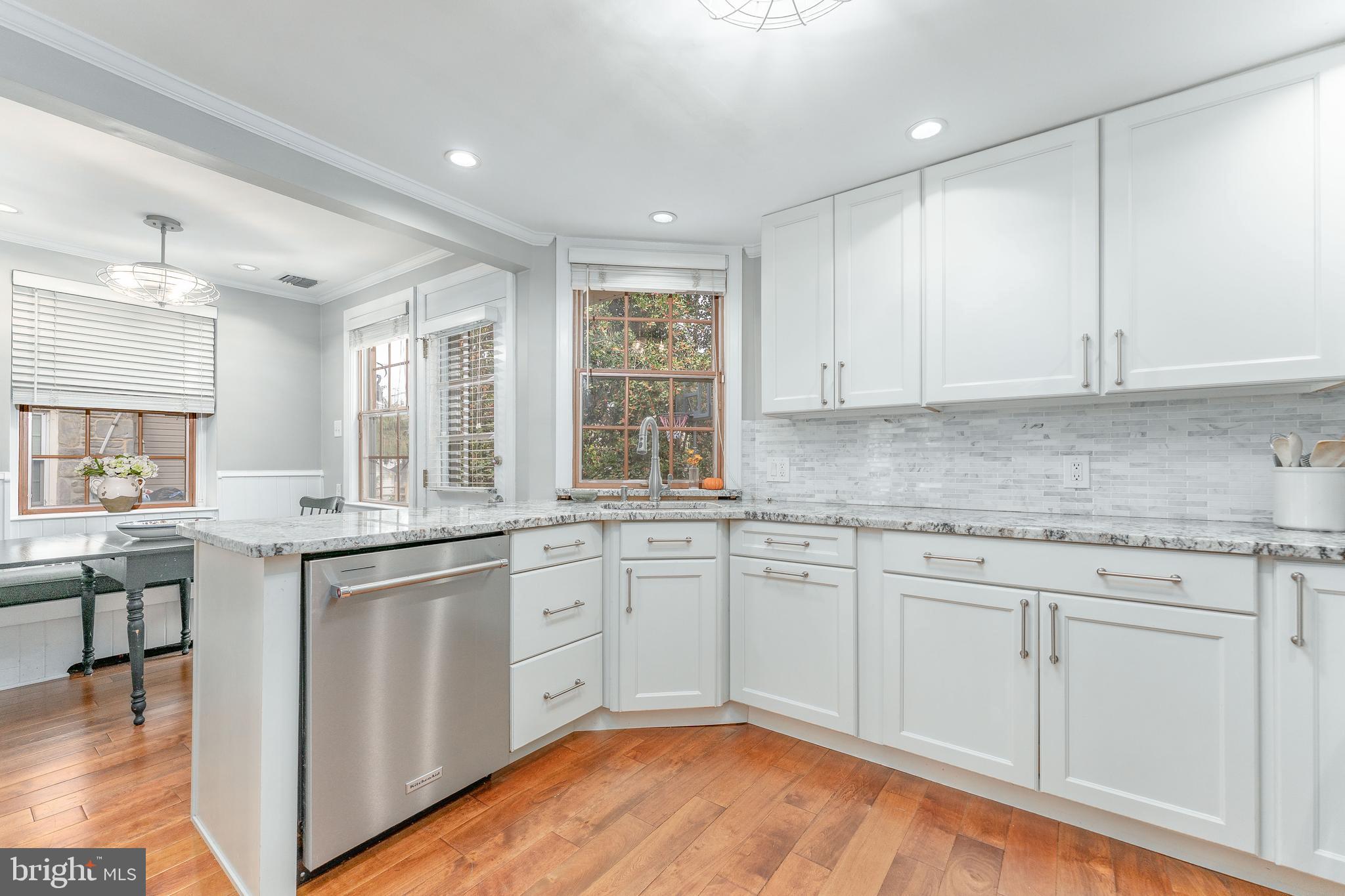 111 Harrogate Road Wynnewood, PA 19096 - Photo 18 of 60 a kitchen with granite countertop white cabinets and white appliances