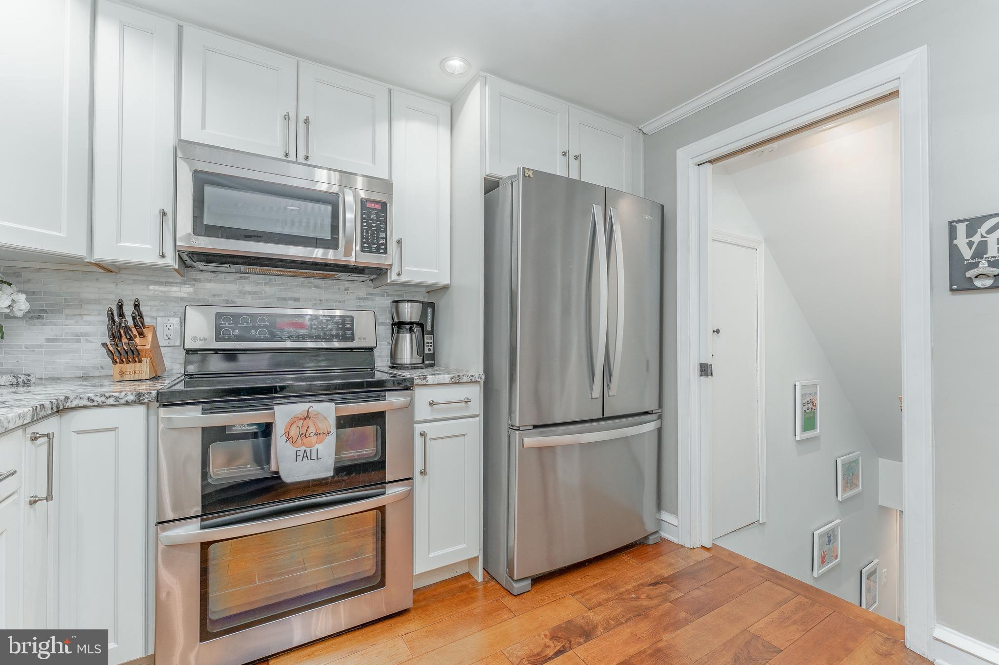 111 Harrogate Road Wynnewood, PA 19096 - Photo 21 of 60 a kitchen with stainless steel appliances granite countertop a refrigerator microwave and sink